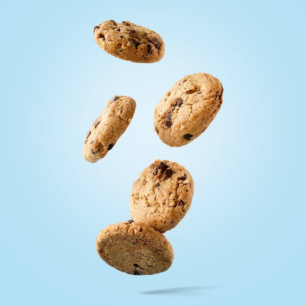 Cookies falling on a blue background